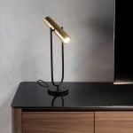Table lamp in black stainless steel and gold-plated stainless steel