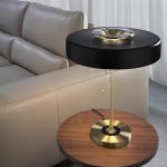Table lamp in gold-plated aluminium and black aluminium