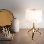 Table lamp in gold-plated steel and white tinted glass