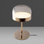 Table lamp in gilded steel with translucent glass shade