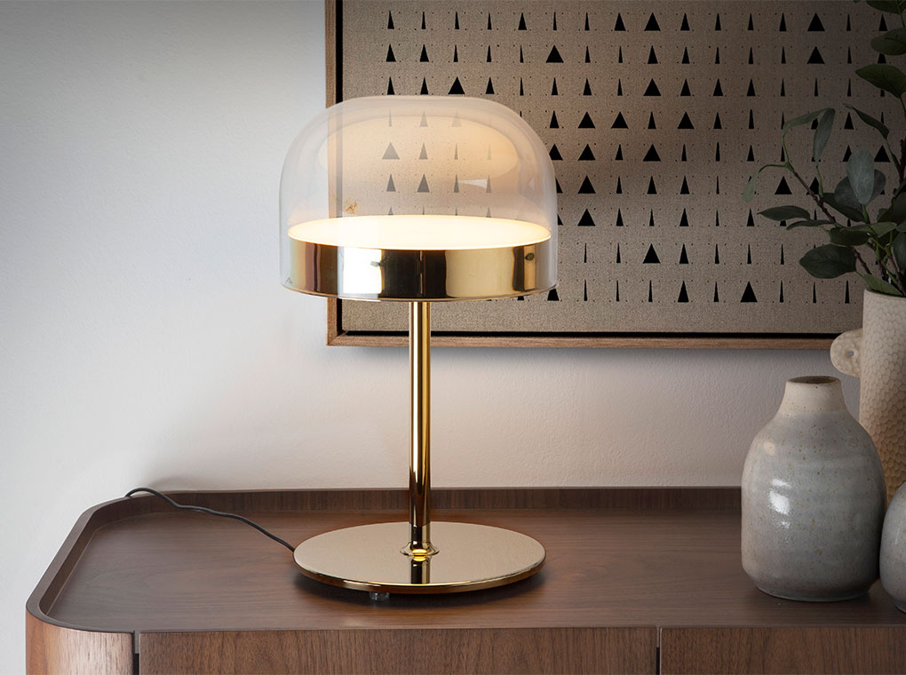 Table lamp in gilded steel with translucent glass shade