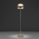 Floor lamp in gold-plated steel and clear glass