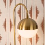 White glass and polished gold-coloured steel table lamp