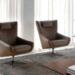 Swivel armchair with leather upholstered cushion