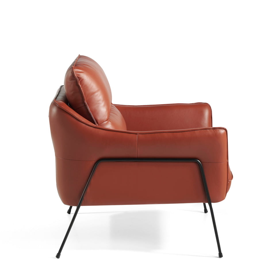 Armchair upholstered in leather and black steel legs Armchair upholstered in leather and black steel legs