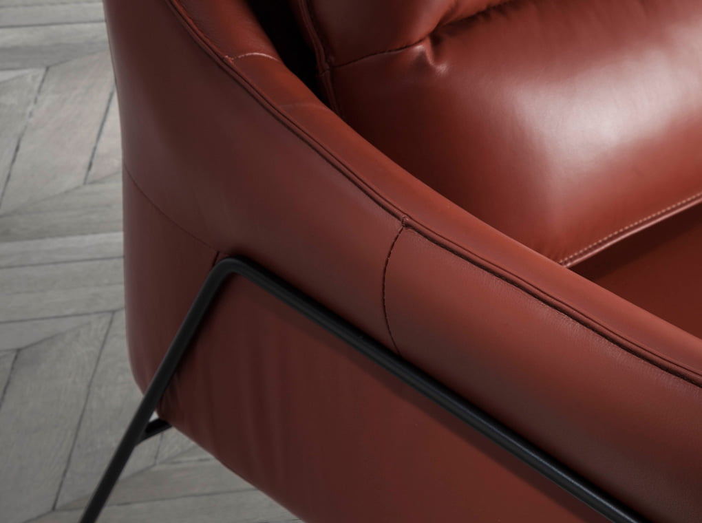 Armchair upholstered in leather and black steel legs Armchair upholstered in leather and black steel legs