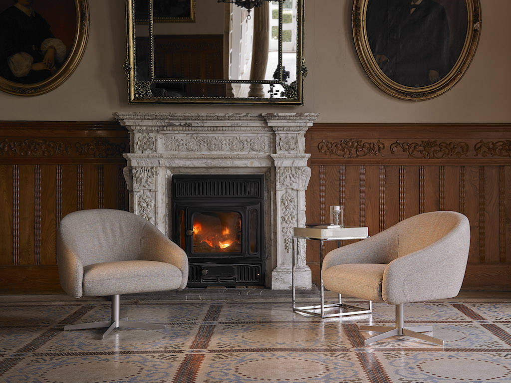 Upholstered armchair with polished stainless steel frame. Upholstered armchair with polished stainless steel frame.