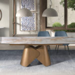 Mesa comedor extensible ovalada barril mármol porcelánico y acero color bronce