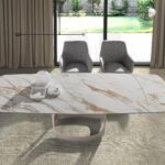 Mesa comedor extensible ovalada barril mármol porcelánico y acero arena metalizado