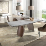 Table de salle à manger extensible ovale en forme de tonneau en marbre porcelanique, acier coloris sable métallisé et bois de noyer