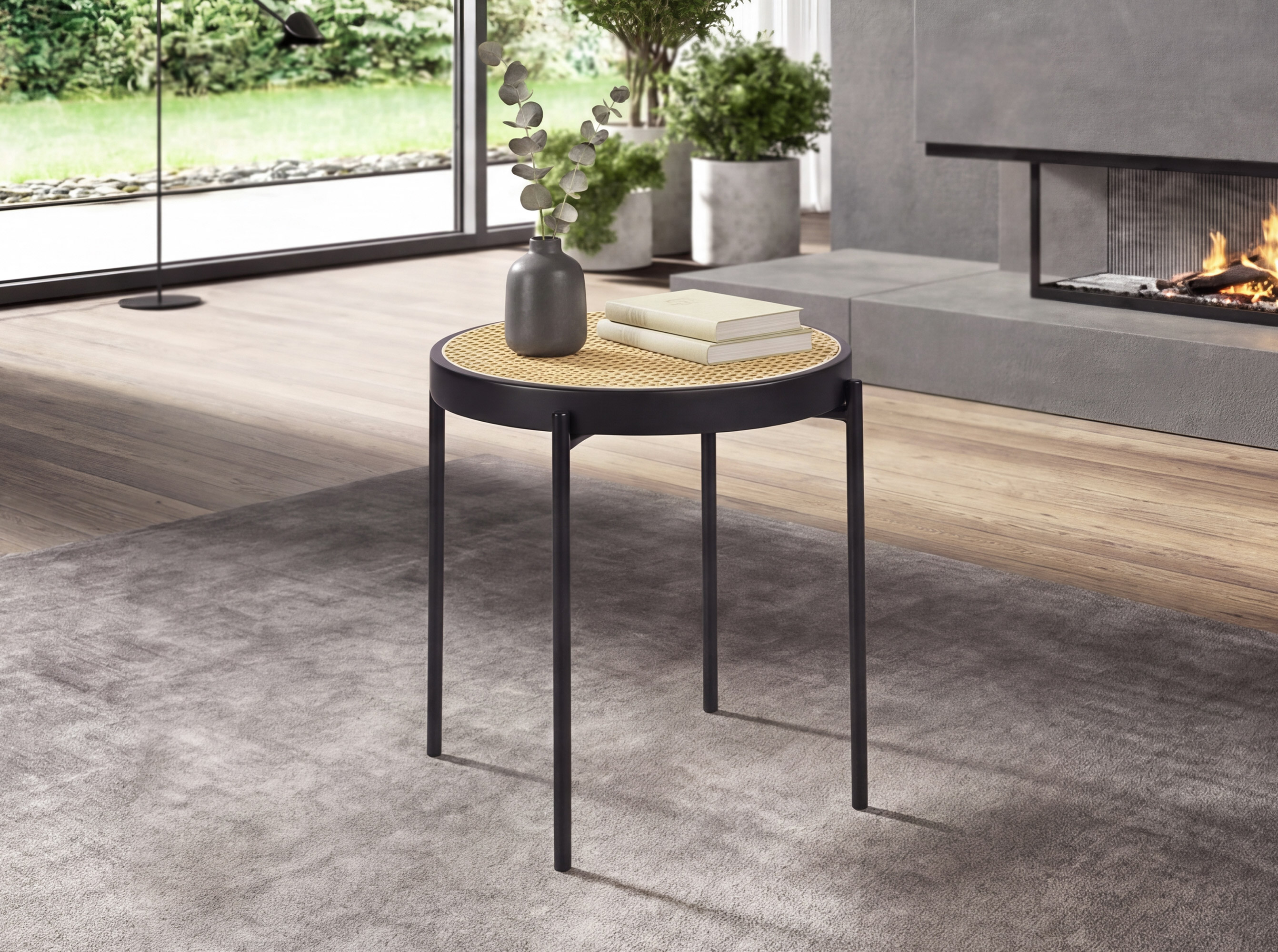 Round corner table in rattan and black steel Round corner table in rattan and black steel