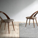 Upholstered chair in walnut veneered wood