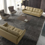 Poltrona girevole con cuscino rivestito in similpelle