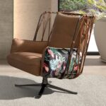 Brown leather and fabric swivel armchair with brown print