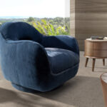 Fauteuil pivotant en velours bleu foncé