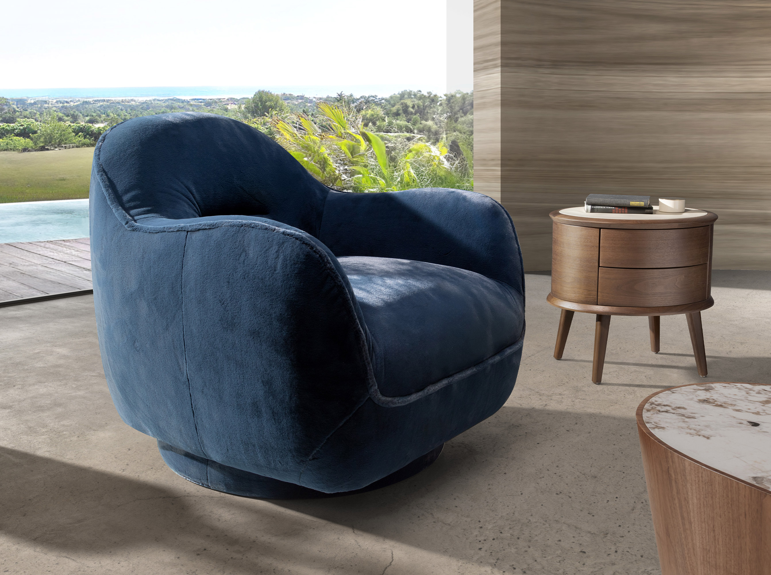 Fauteuil pivotant en velours bleu foncé Fauteuil pivotant en velours bleu foncé