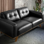 2-seater sofa upholstered in tufted leather