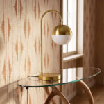 White glass and polished gold-coloured steel table lamp