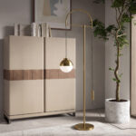 White glass and polished gold-coloured steel floor lamp