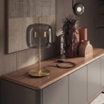 Black smoked glass and polished gold-coloured steel table lamp