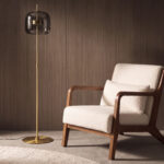 Black smoked glass and polished gold-coloured steel floor lamp