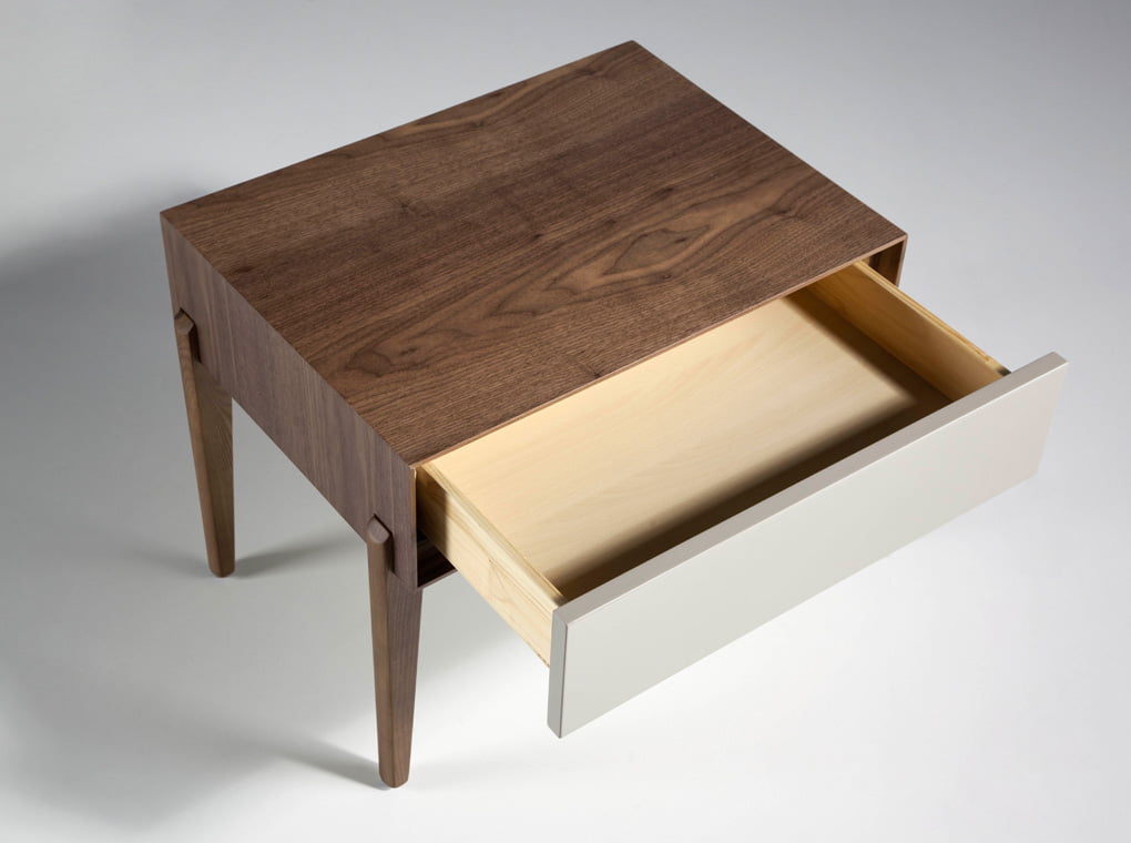 Bedside table with solid wooden legs and a Walnut veneer structure Bedside table with solid wooden legs and a Walnut veneer structure