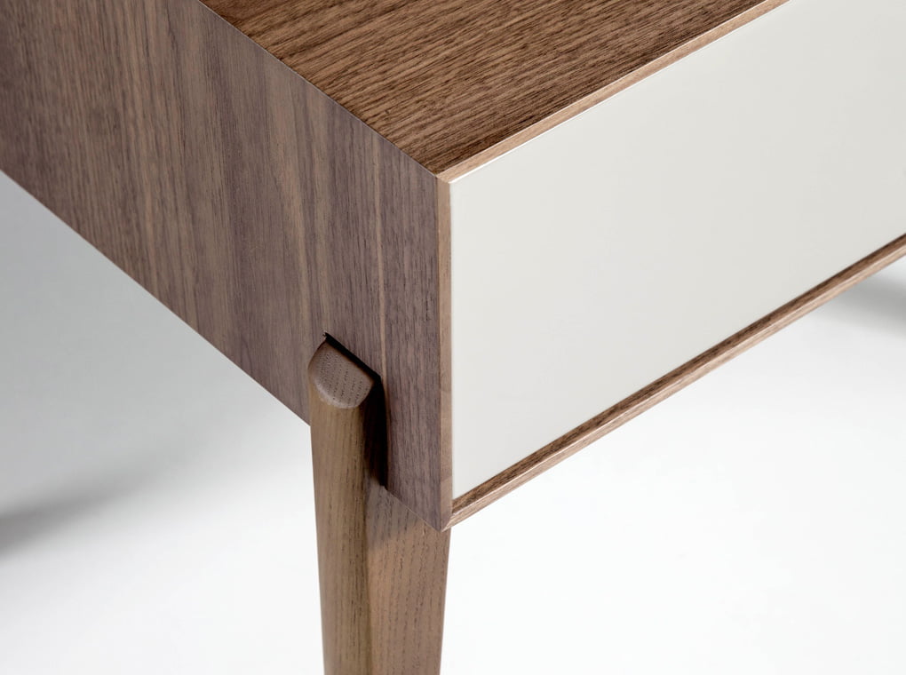 Bedside table with solid wooden legs and a Walnut veneer structure Bedside table with solid wooden legs and a Walnut veneer structure