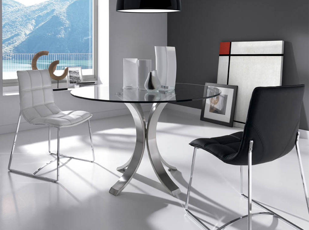 Dining table with polished stainless steel base. Dining table with polished stainless steel base.