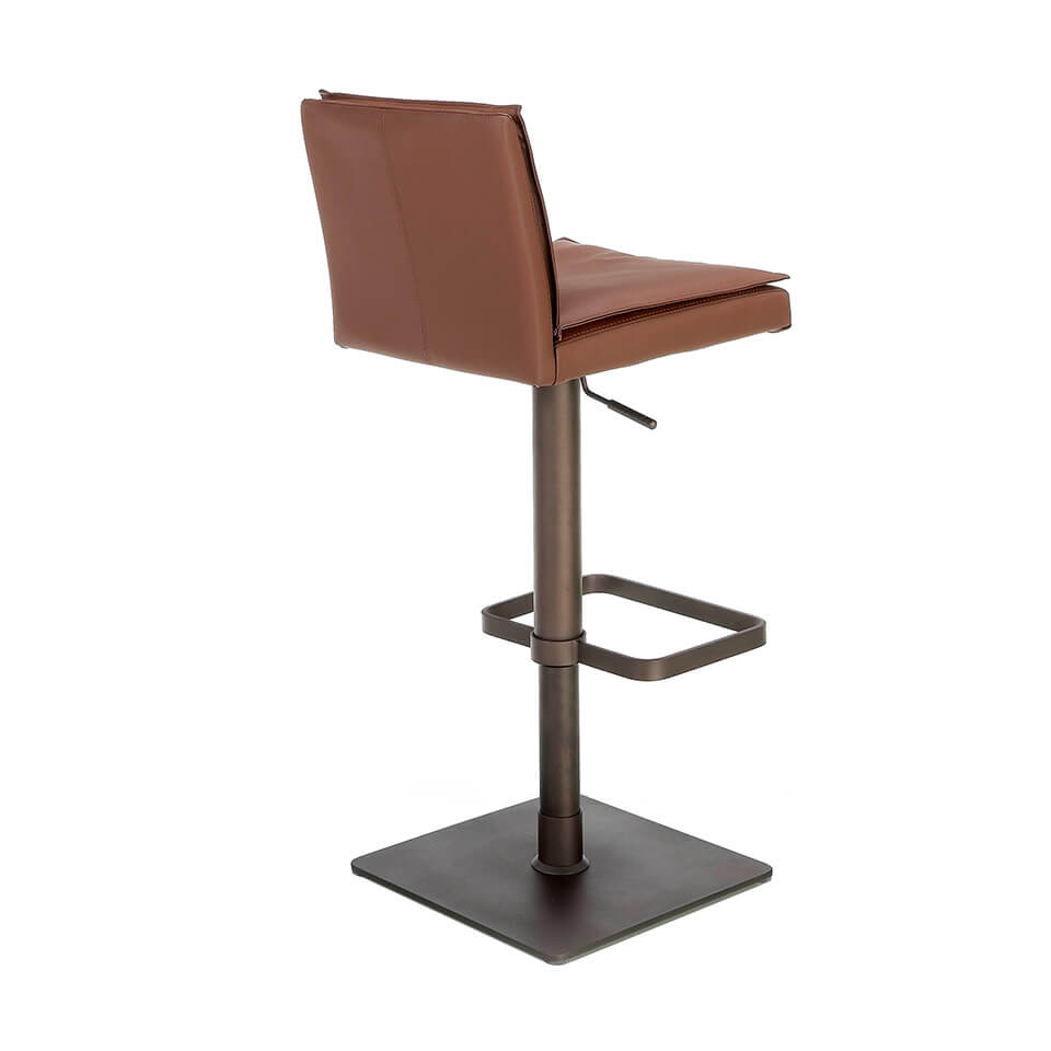 Stool Upholstered in brown leatherette with legs in brown epoxy Stool Upholstered in brown leatherette with legs in brown epoxy