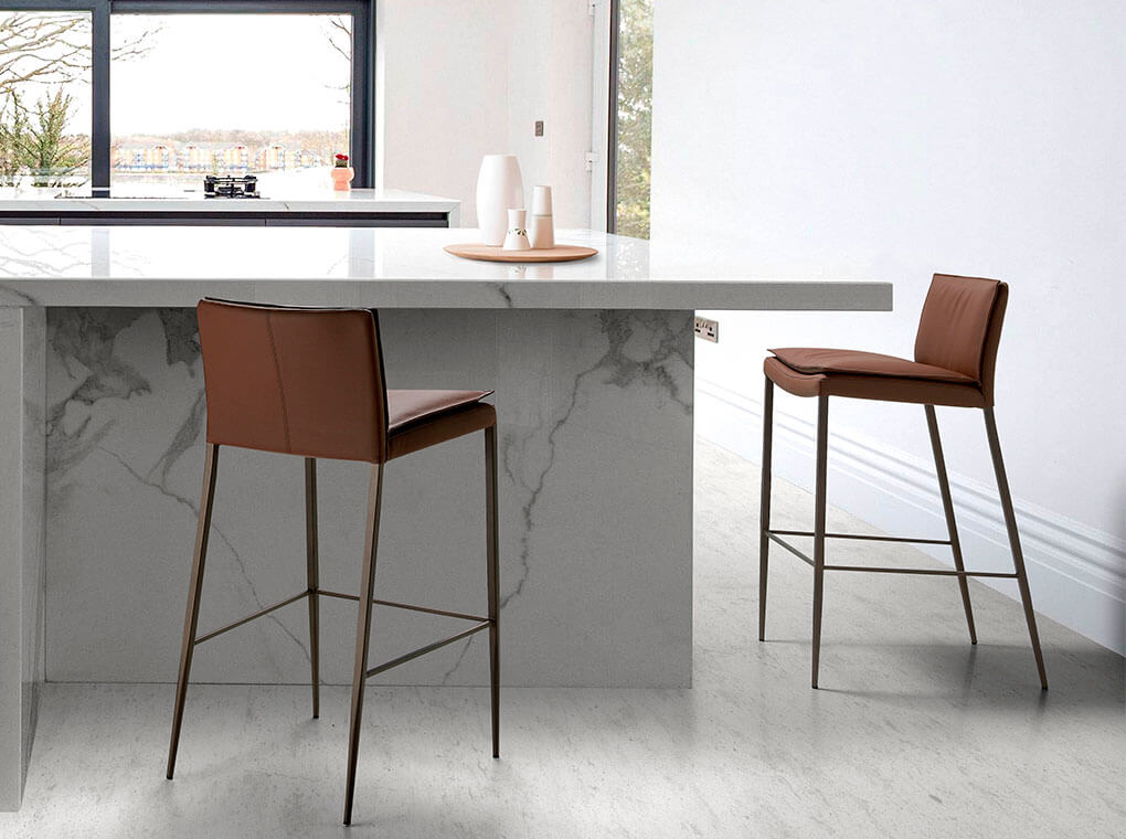 Stool upholstered in leatherette with legs in epoxy Stool upholstered in leatherette with legs in epoxy