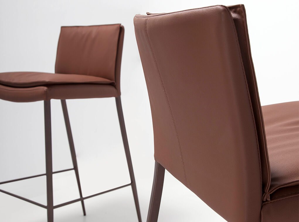 Stool upholstered in leatherette with legs in epoxy Stool upholstered in leatherette with legs in epoxy