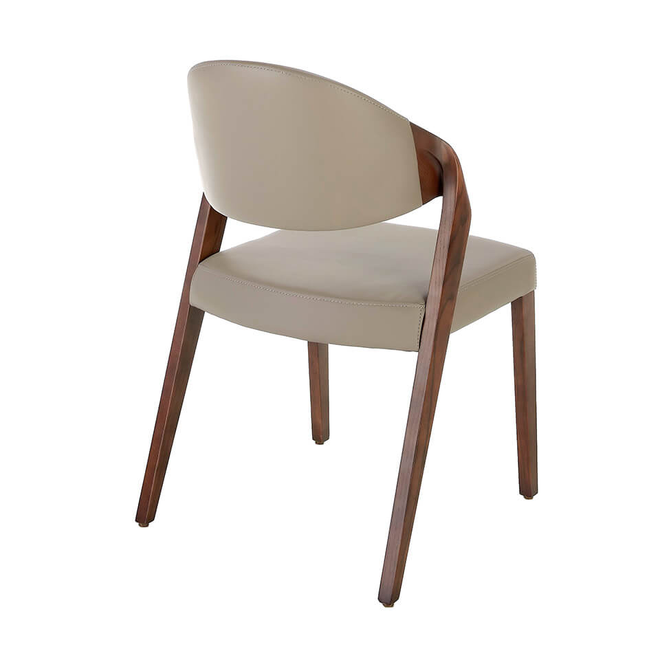 Chair upholstered in leatherette with Walnut colored wooden structure Chair upholstered in leatherette with Walnut colored wooden structure
