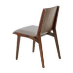 Chair upholstered in leatherette with Walnut colored wooden structure