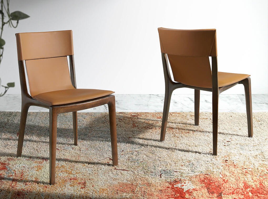 Chair upholstered in leather with structure in ash wood Chair upholstered in leather with structure in ash wood