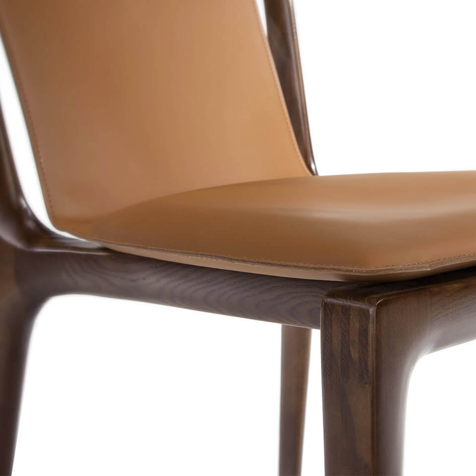 Chair upholstered in leather with structure in ash wood Chair upholstered in leather with structure in ash wood