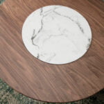 Round dining table in Walnut wood and porcelain detail