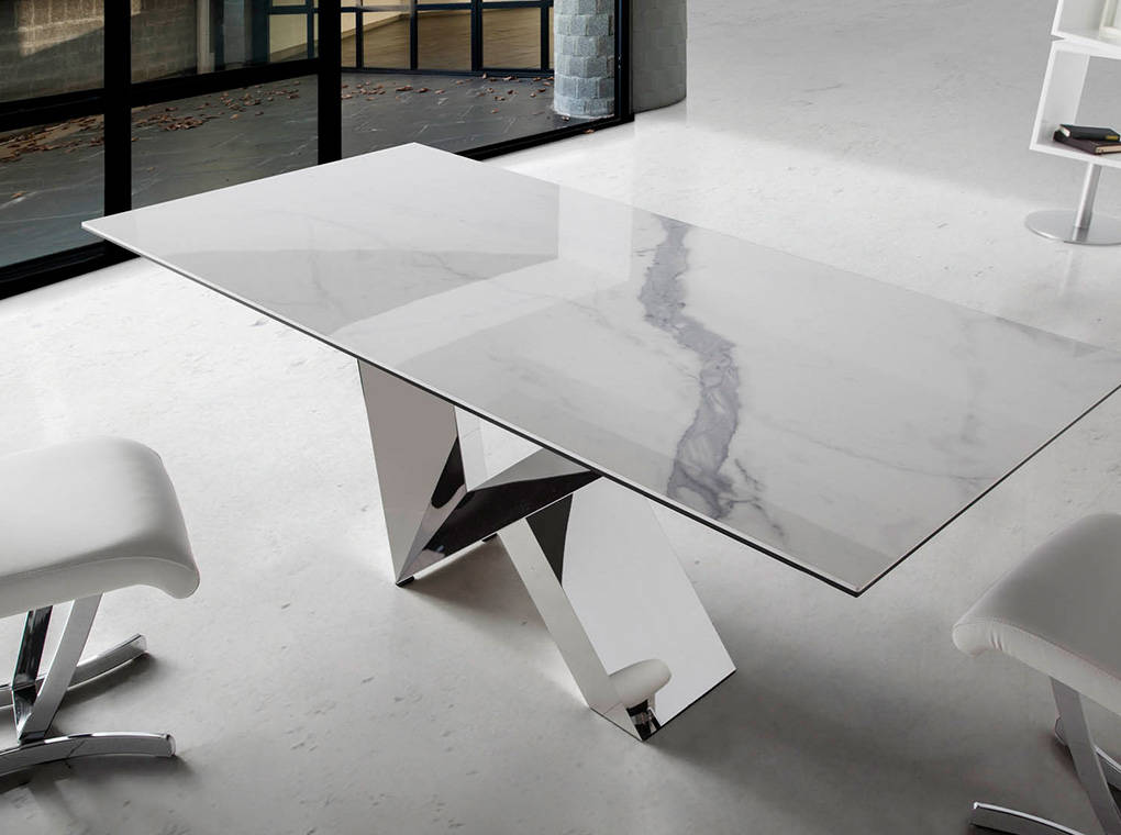 Dining table with ceramic marble top and stainless steel frame. Dining table with ceramic marble top and stainless steel frame.