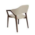 Chaise rembourrée en similicuir avec structure en bois couleur noyer
