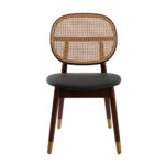 Chaise rembourrée en similicuir avec dossier en rotin et pieds en bois de noyer