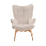 Sillón tapizado en tela capitoné