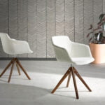 Swivel chair upholstered in fabric with solid wood legs in Walnut color