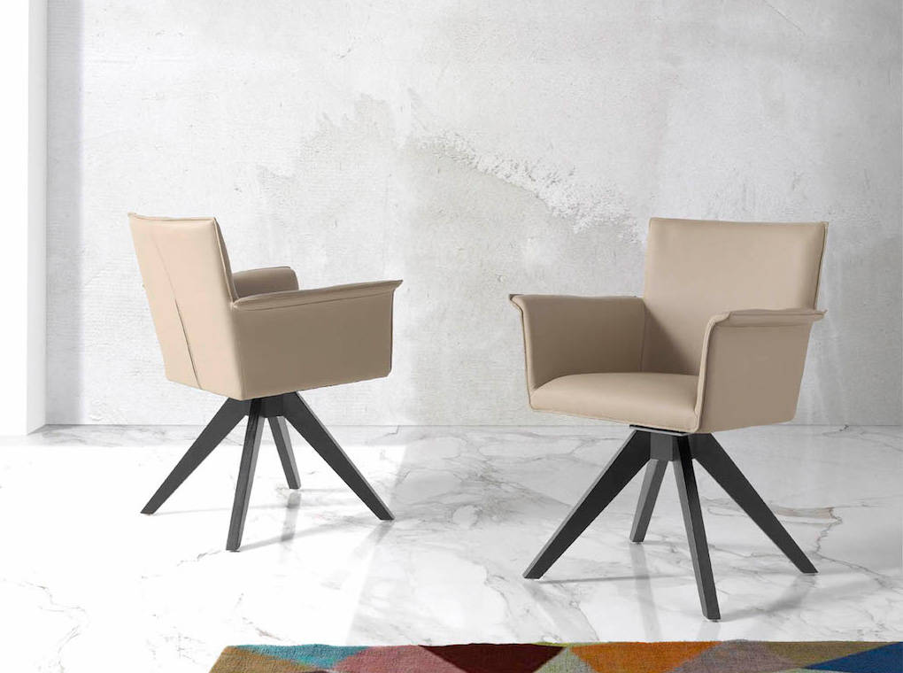 Swivel chair with wengue-coloured wooden legs and upholstered seat. Swivel chair with wengue-coloured wooden legs and upholstered seat.