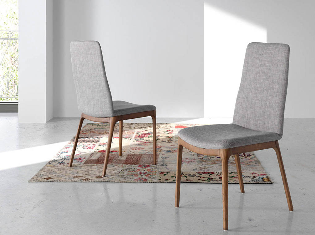 Upholstered chair with wood structure in walnut color. Upholstered chair with wood structure in walnut color.
