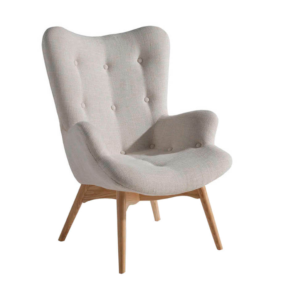 Armchair upholstered in tufted fabric