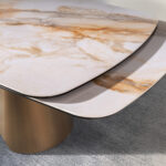 Mesa comedor extensible ovalada barril mármol porcelánico y acero color bronce