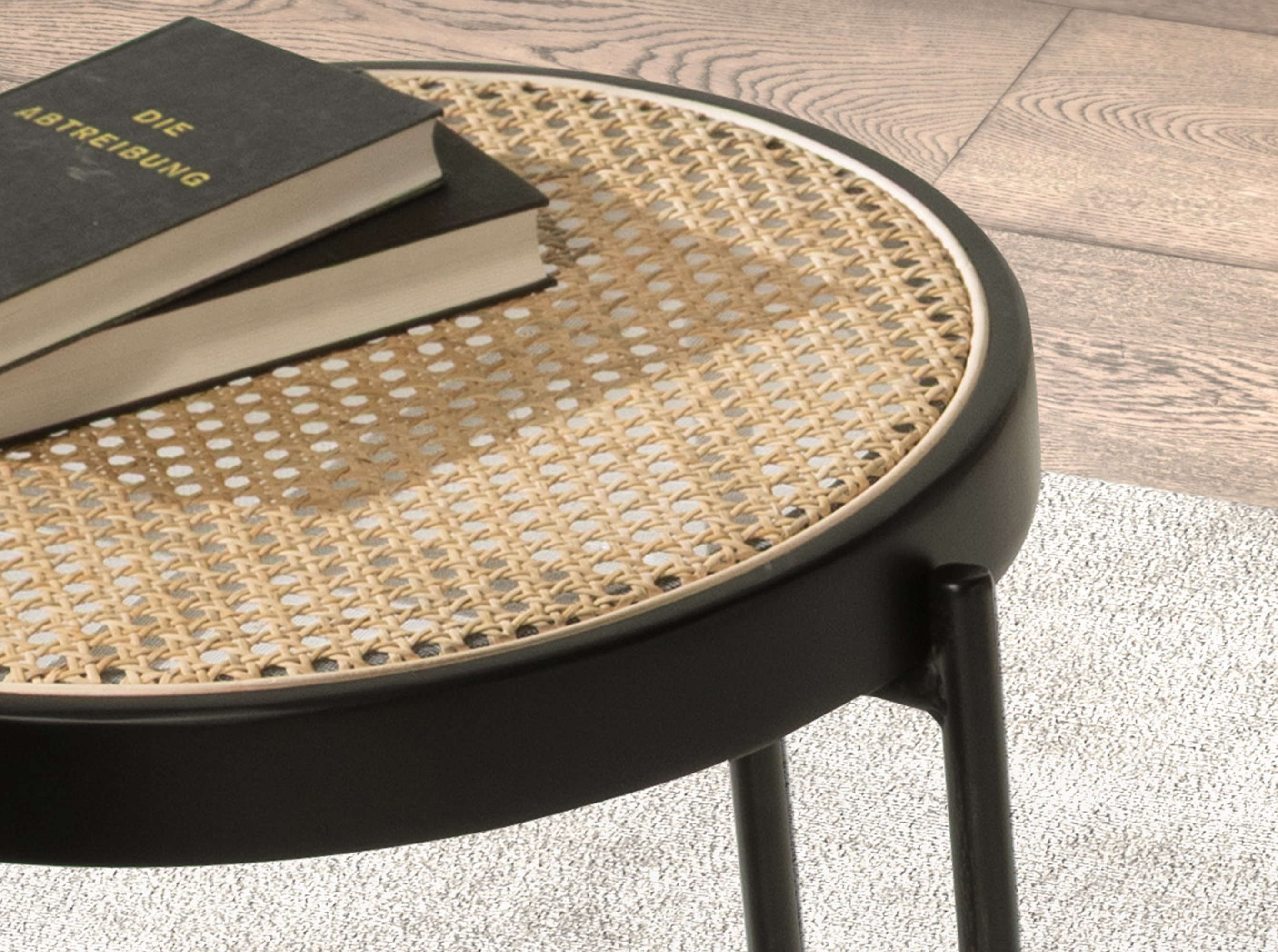 Round corner table in rattan and black steel Round corner table in rattan and black steel
