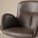 Swivel chair in chocolate brown leatherette