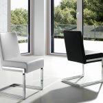 Chair upholstered in leatherette with chromed steel frame