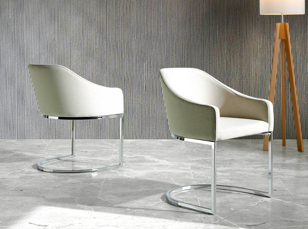 Upholstered Armchair with stainless steel frame. Upholstered Armchair with stainless steel frame.