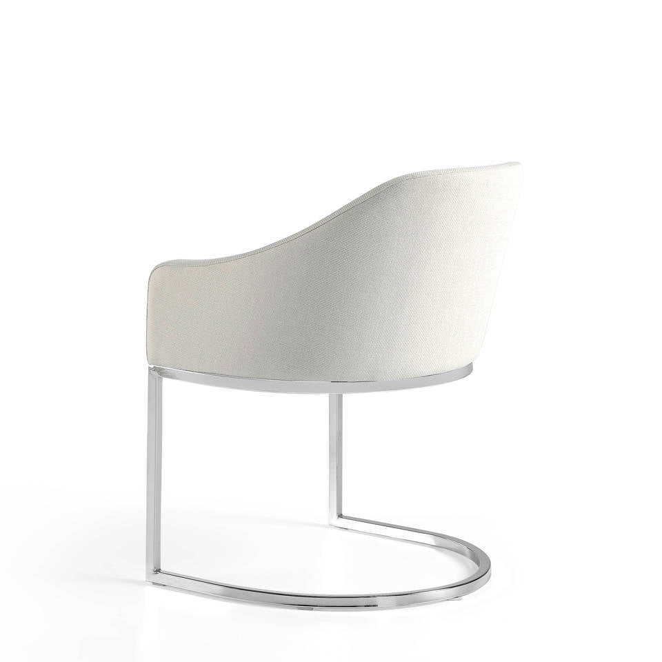 Upholstered Armchair with stainless steel frame. Upholstered Armchair with stainless steel frame.